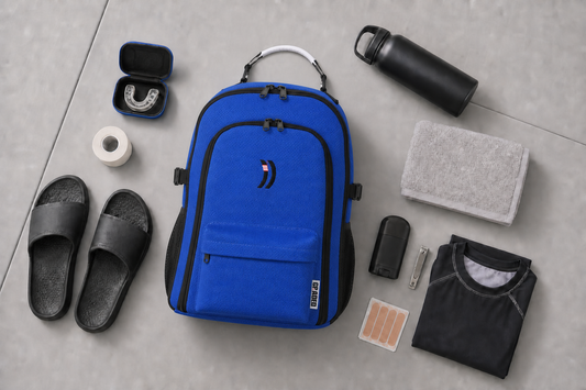 Blue Graded Backpack essentials flat lay