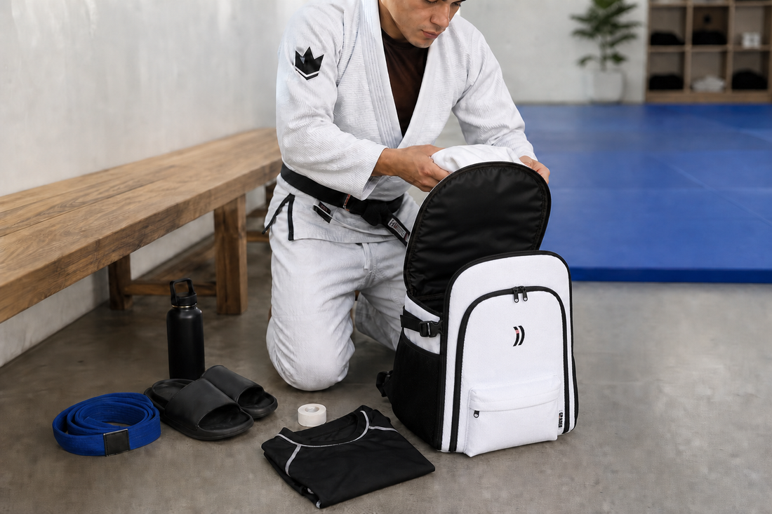 BJJ athlete packing the Graded Backpack before competition day